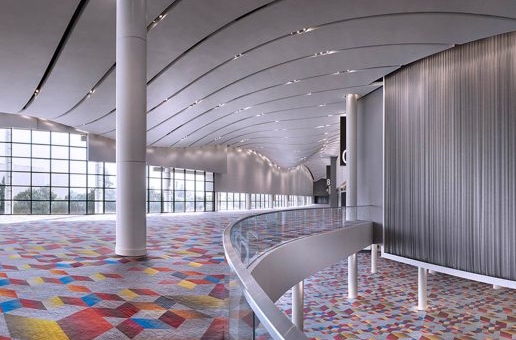 A large, open room with a colorful pattern on the floor