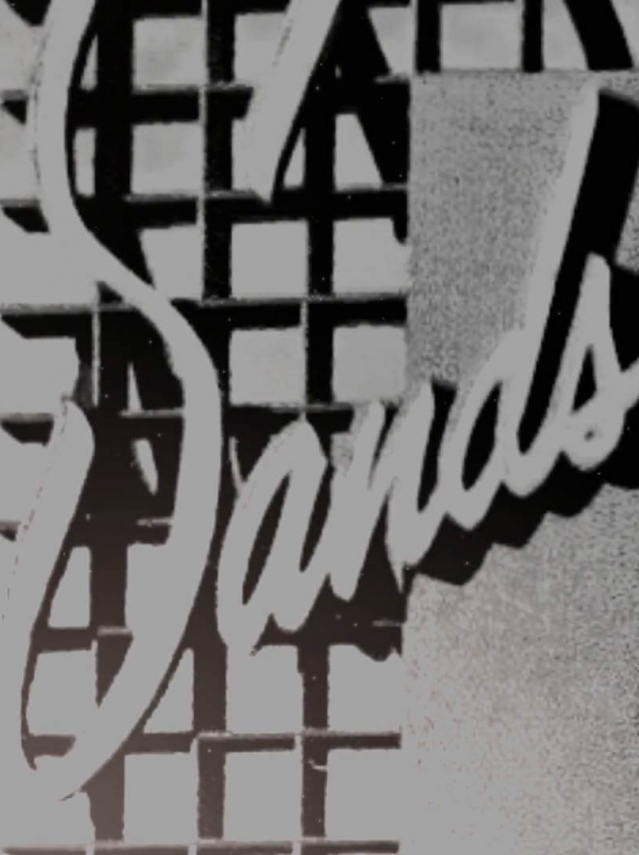 Black and white photo of an old Sands logo