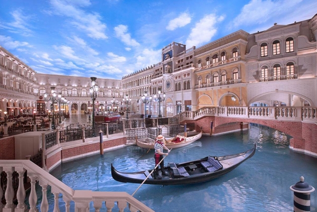 A lone gondola operator on the water