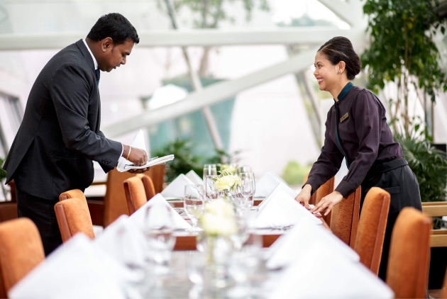 Image of Sands employees setting a table