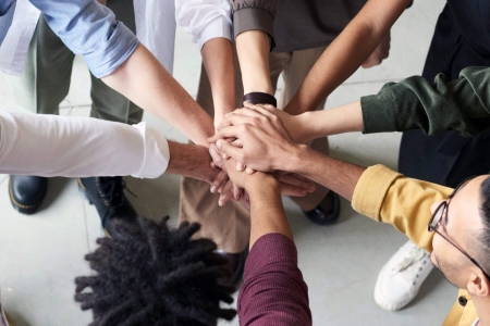 A team handshake viewed from aboce