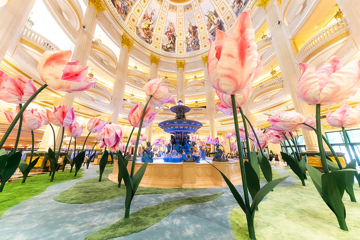 The spring bloom art installation at The Parisian Macao. A photo of very large tulips under the lobby rotunda.